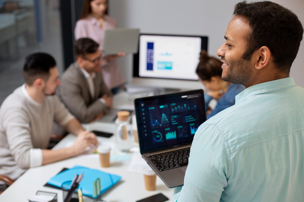 A data engineering team reviewing dashboards together